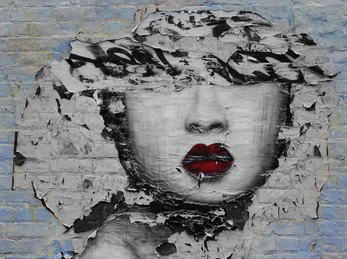 Graffiti Art. Foto: Ian Britton (flickr CC BY-NC) Ansikt av graffiti som oppløser seg frå veggen