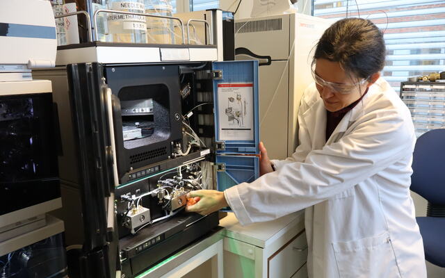 Senior engineer Lene Grutle standing beside a new instrument