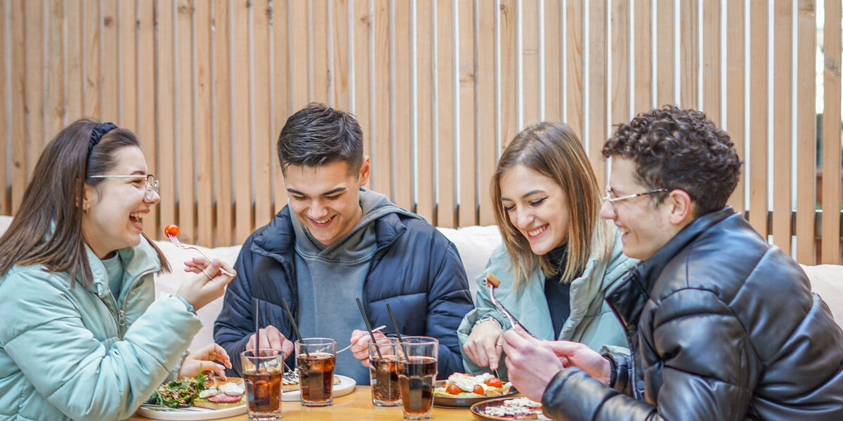 Teenagers having fun drinking soft drinks